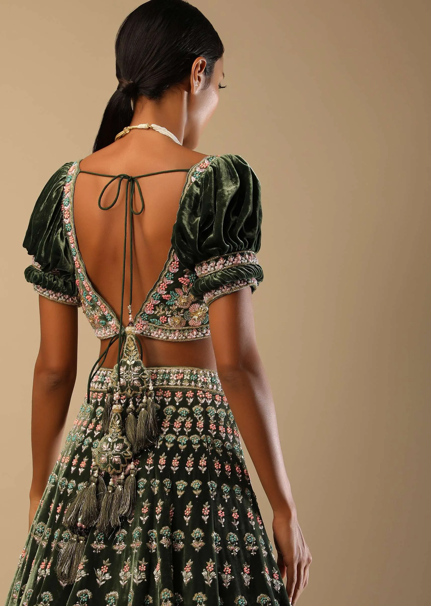 Palace Green Lehenga Choli In Velvet With Short Puff Sleeves And Multi Colored Hand Embroidery In Floral And Geometric Motifs