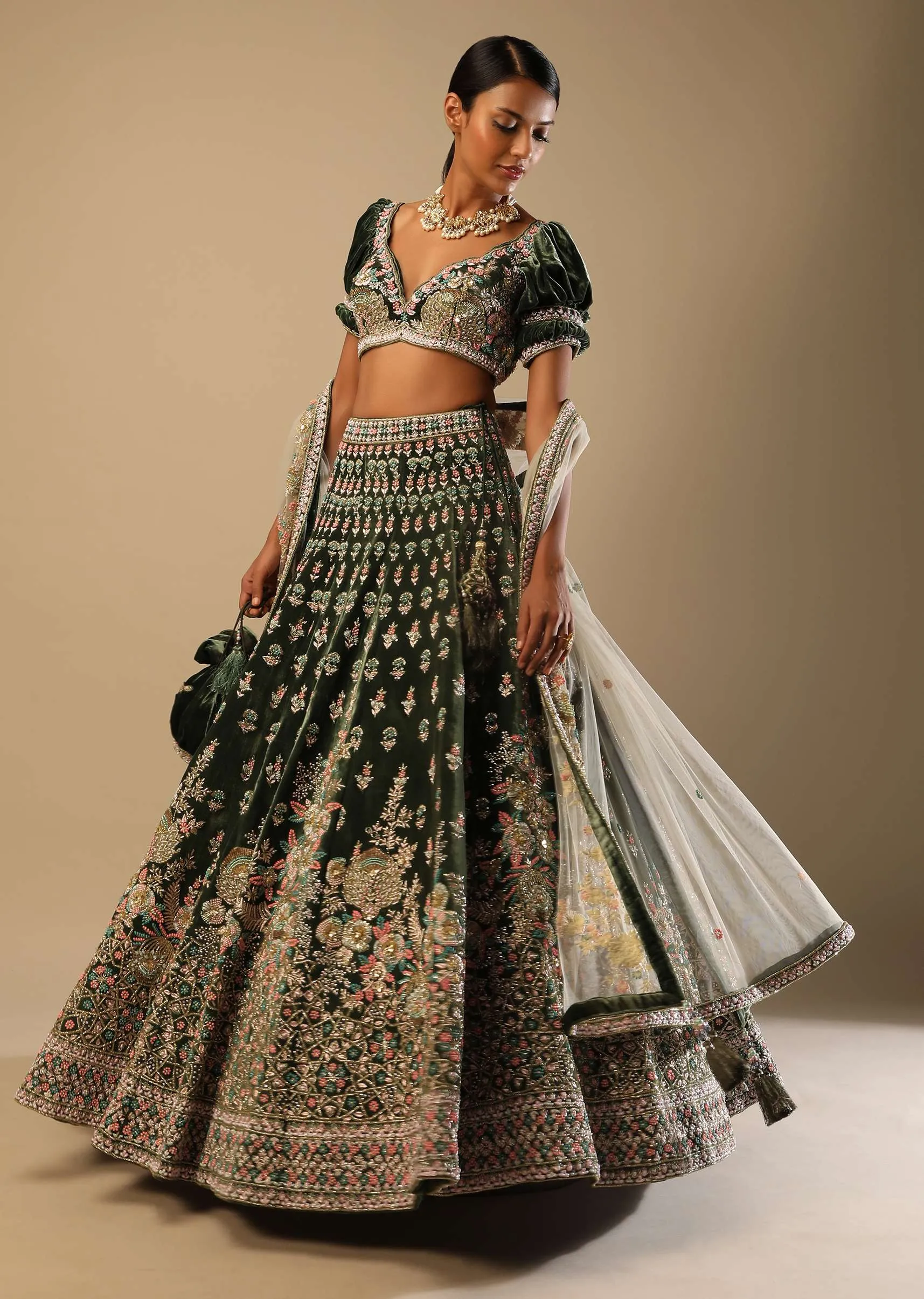 Palace Green Lehenga Choli In Velvet With Short Puff Sleeves And Multi Colored Hand Embroidery In Floral And Geometric Motifs